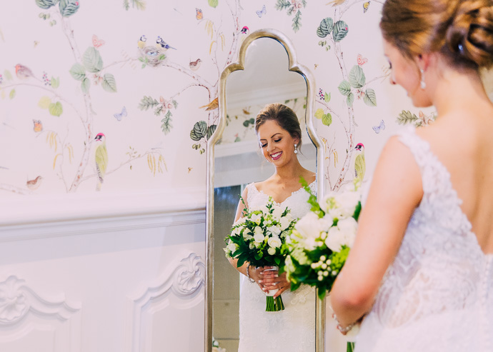 Bride framed in a mirror reflection