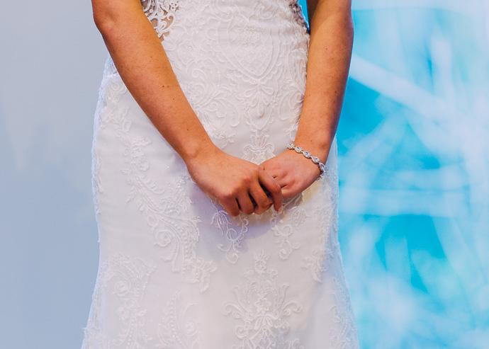 Bride clasping her hands together