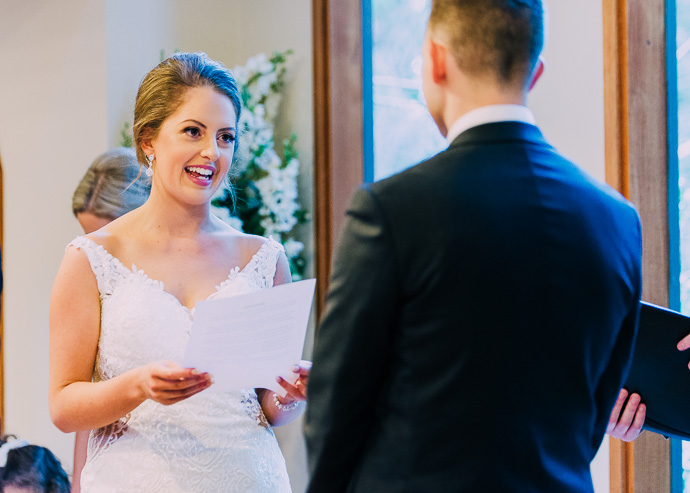 Bride reading vows to groom