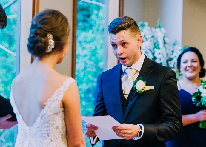 Groom reading his vows