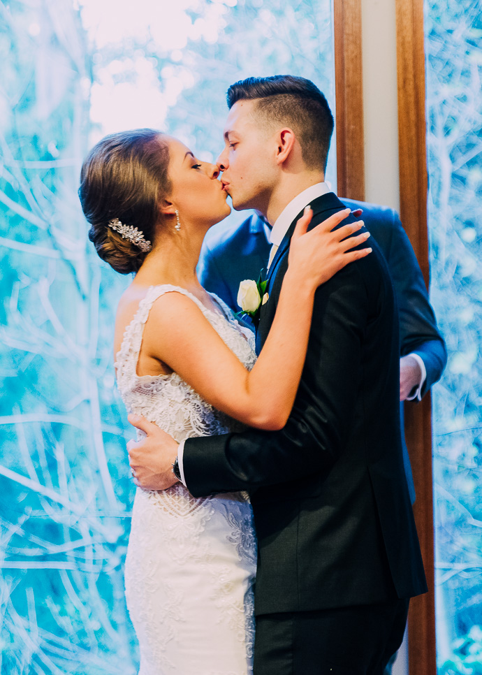 Bride and groom kissing