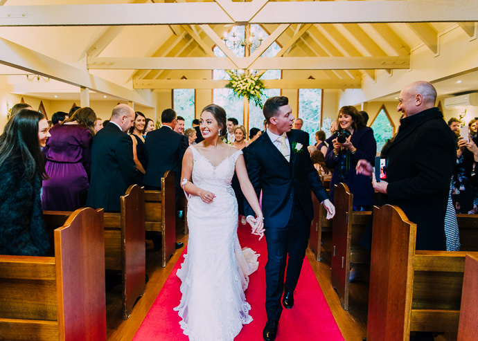 Bride and groom walking down the aisle