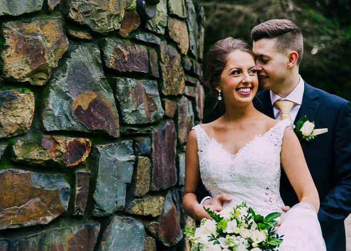 Groom whispering to bride