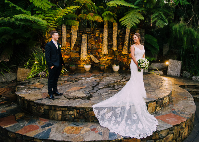 Bride looking over her shoulder at groom