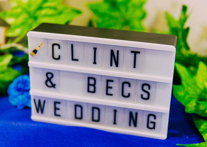 A signboard that reads "Clint and Bec's wedding"