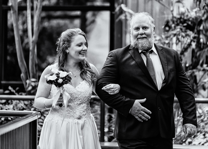 A bride walking down the aisle with her father