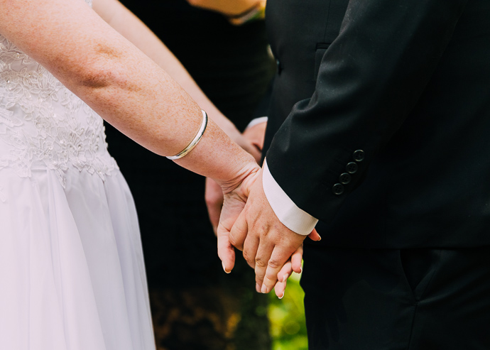 Two people holding hands