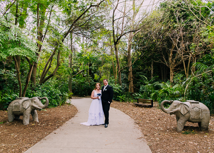 Melbourne Zoo Weddings - A bride and groom standing in a garden
