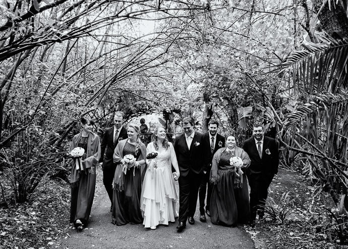A bridal party walking, black and white