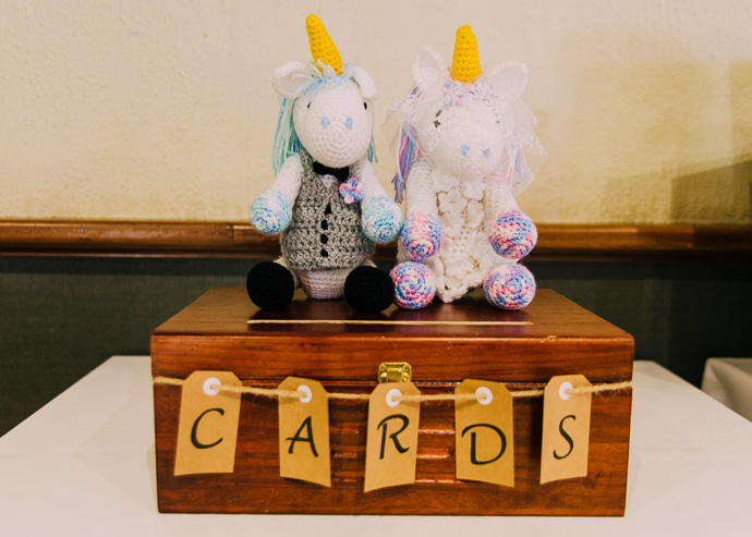 A wooden box with two unicorns on it, labelled "Cards"