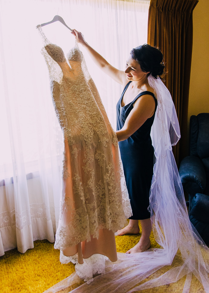 A woman holding a wedding dress
