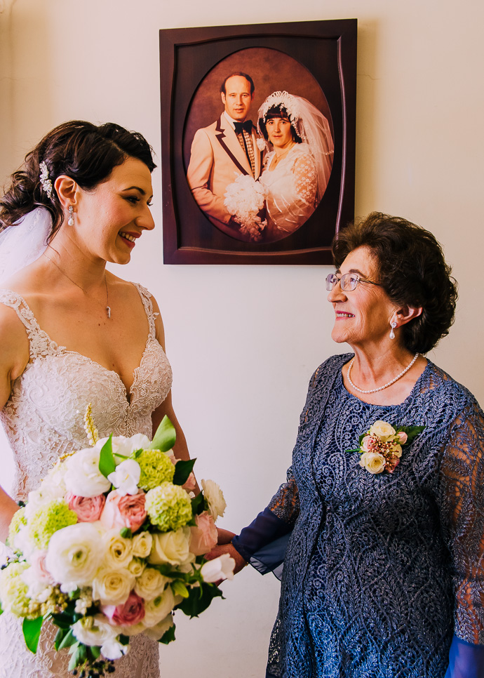 A bride and her mother photographed with an old portrait