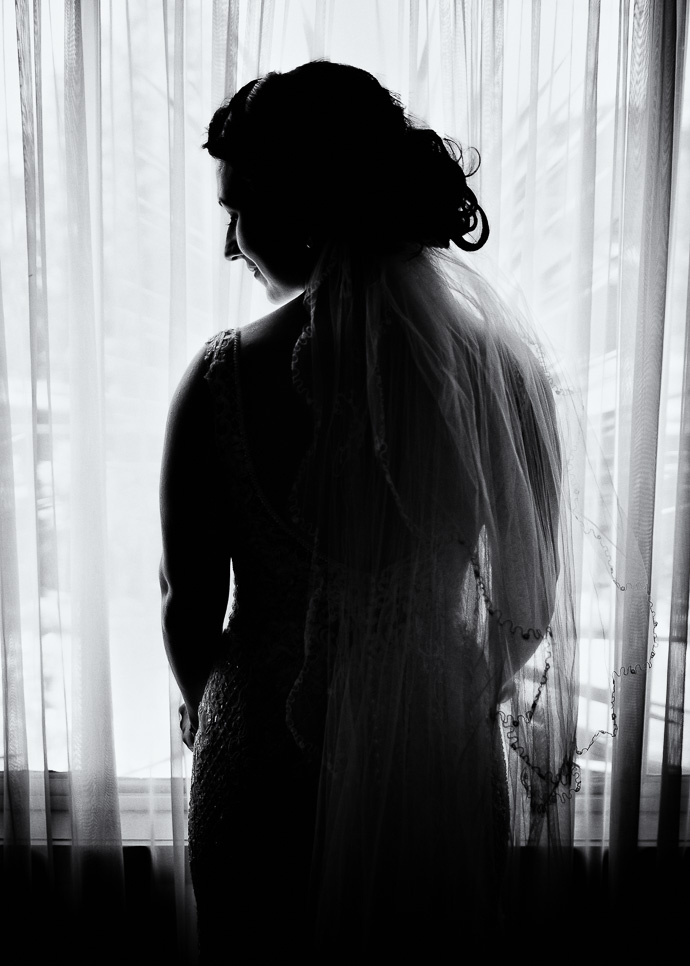 A bride standing by the window