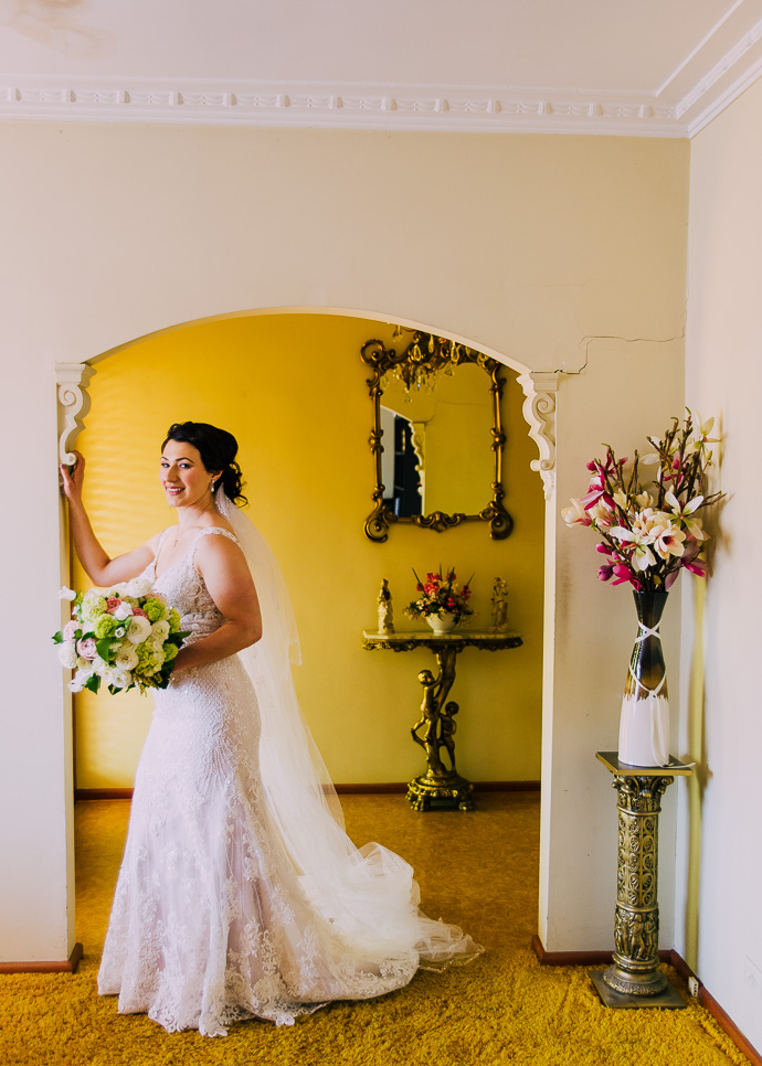 A bride standing in an archway