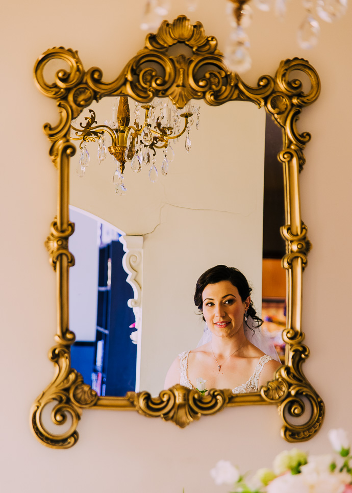 A bride photographed in the mirror