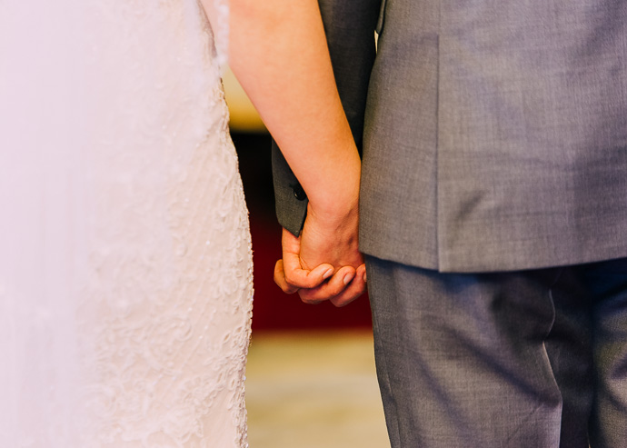 Two people holding hands