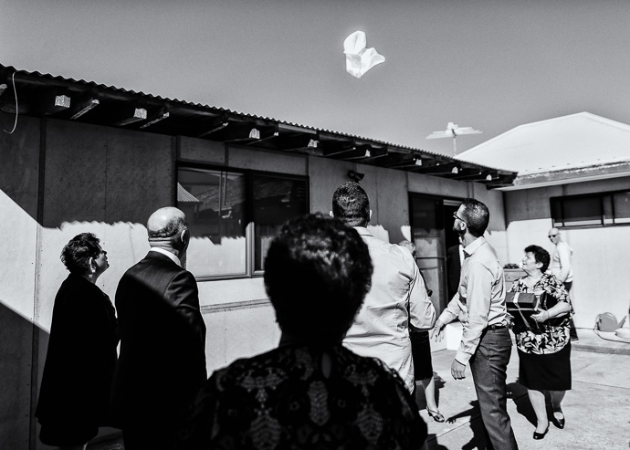 A man throwing a towel in the air