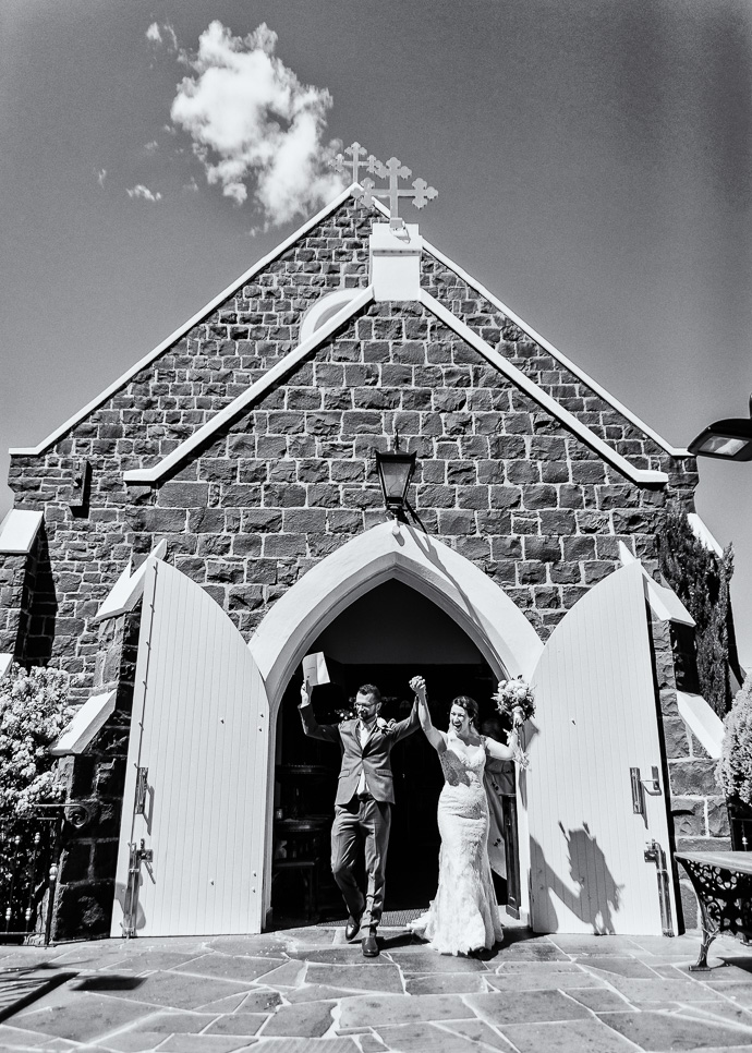 A bride and groom leaving the church, black and white