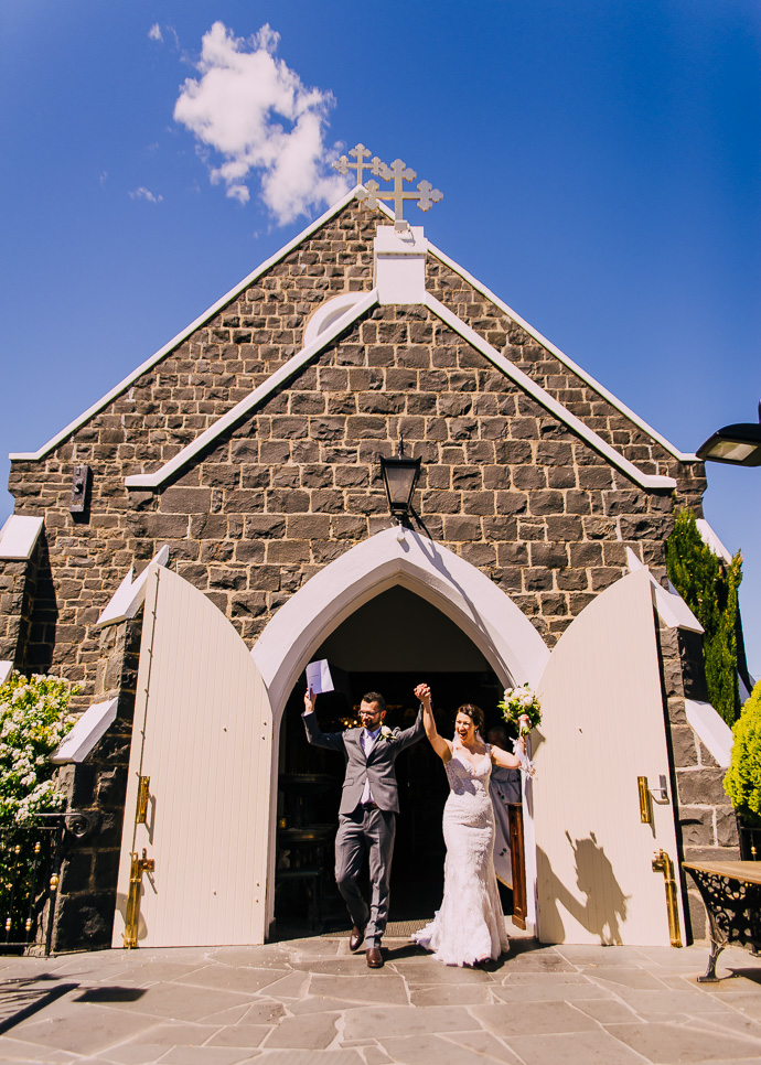 A bride and groom leaving the church