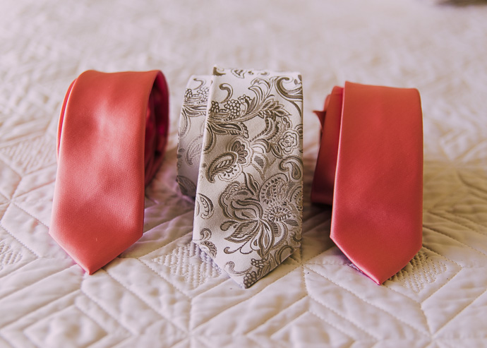 Two pink ties and a white men's tie