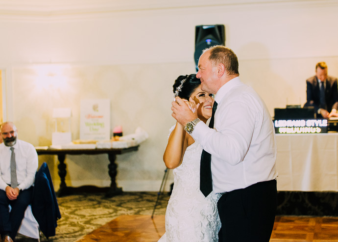 Guests celebrating and dancing at a wedding reception