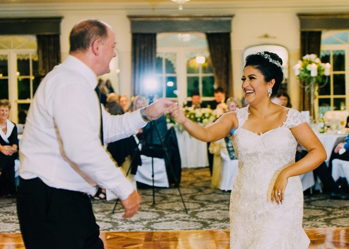 Guests celebrating and dancing at a wedding reception