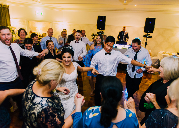 Guests celebrating and dancing at a wedding reception