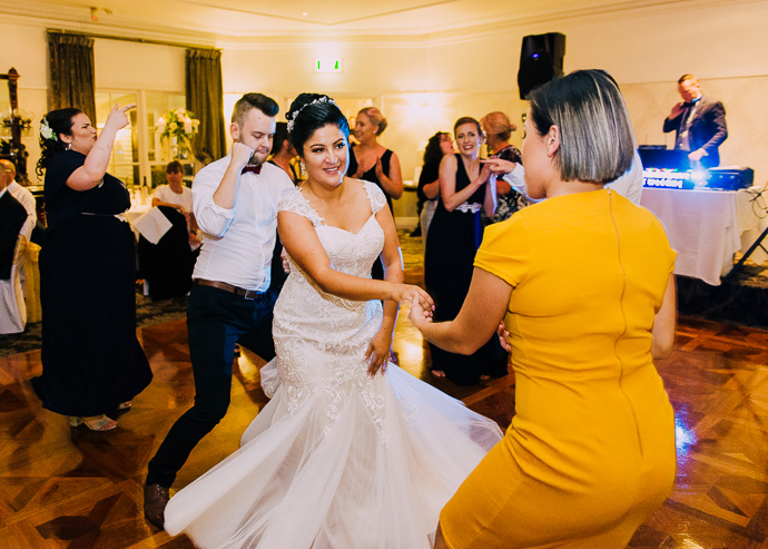 Guests celebrating and dancing at a wedding reception