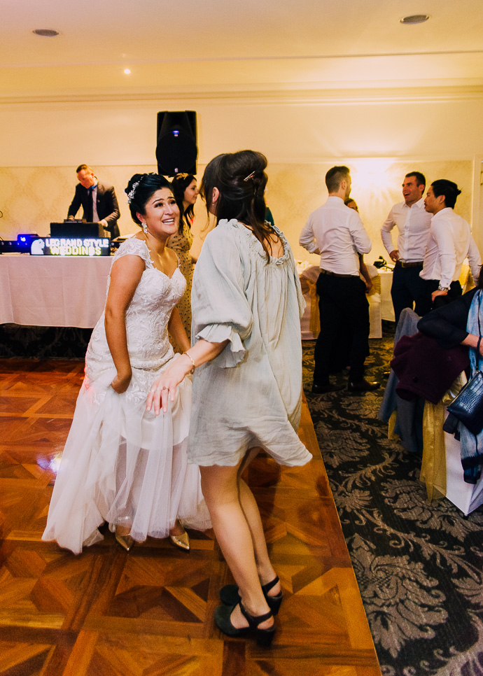 Guests celebrating and dancing at a wedding reception