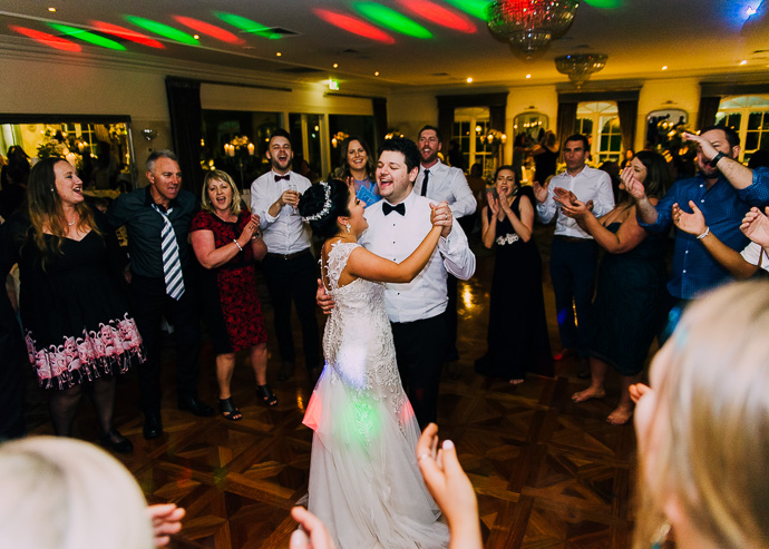 Guests celebrating and dancing at a wedding reception