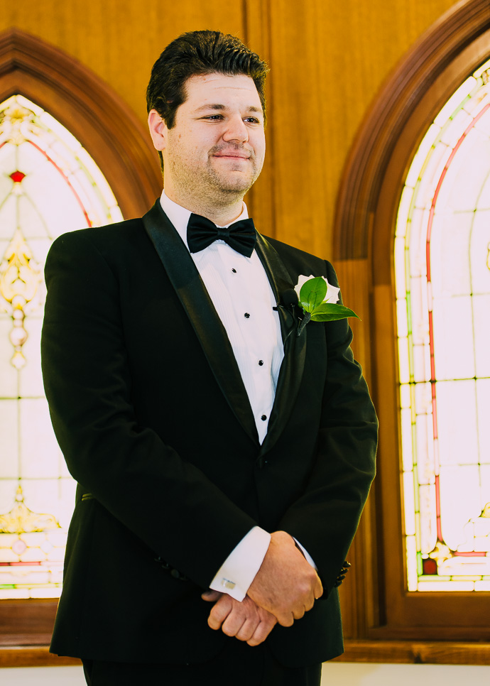 A groom looking down the aisle