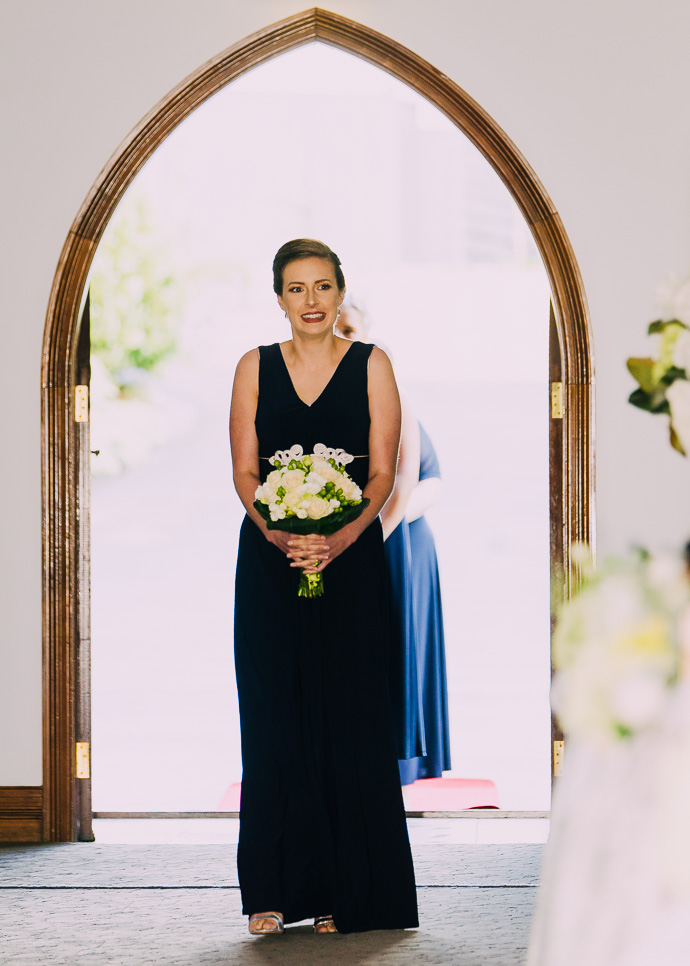 A bridesmaid walking
