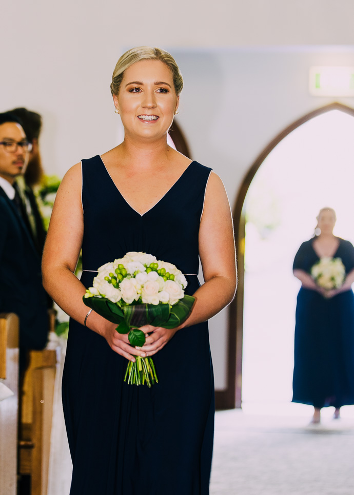 A bridesmaid walking