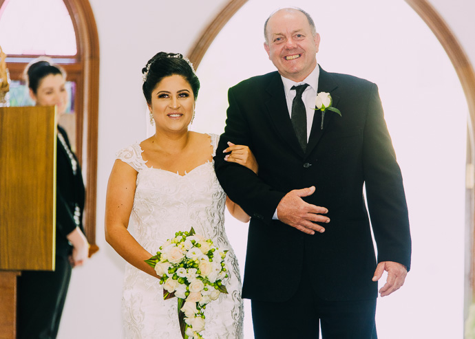 A bride and her father walking down the aisle