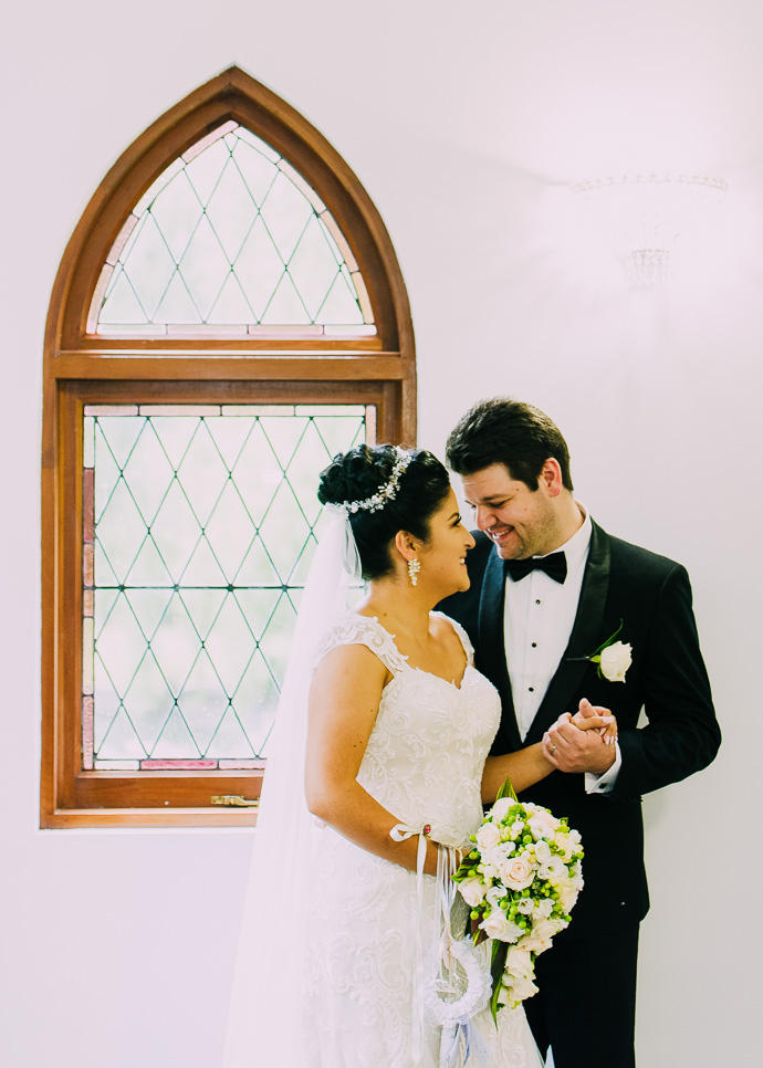 A bride and groom snuggling and talking