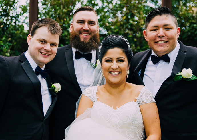 A bride with 3 groomsmen