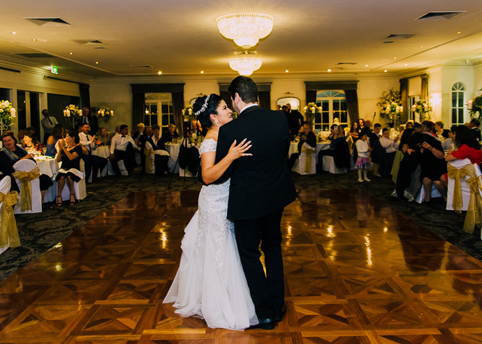 A bride and groom dancing