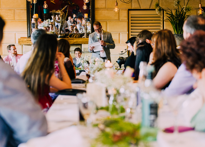 Guests giving speeches at a wedding
