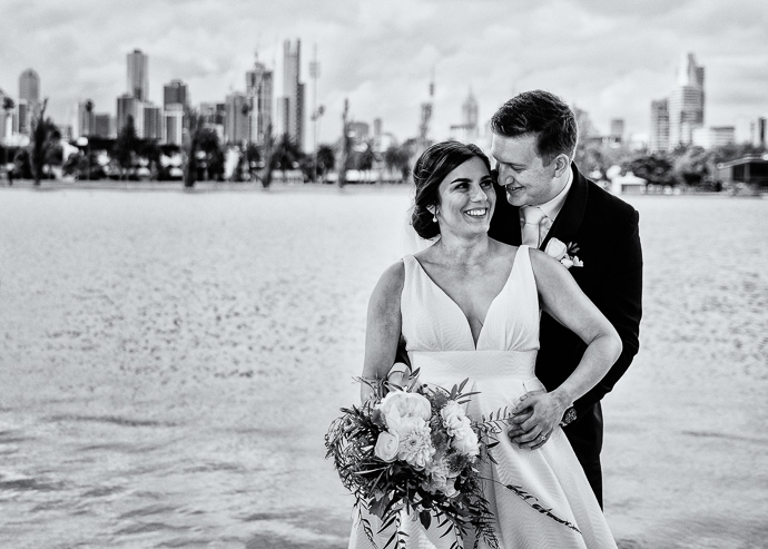 Two Ton Max - A bride and groom walking next to Albert Park Lake, near Carousel in St Kilda