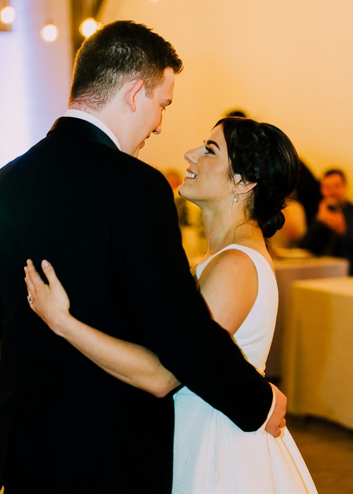 A bride and groom dancing at the wedding reception at Two Ton Max