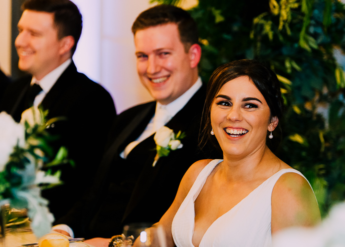A bride and groom laughing