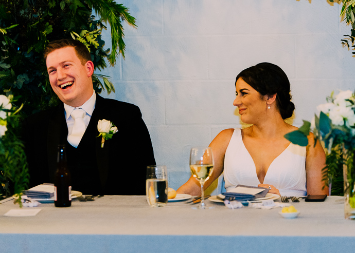 A bride and groom laughing