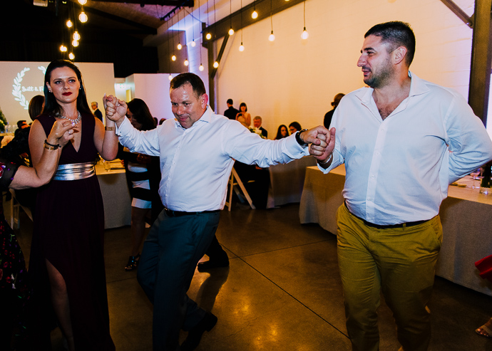 Men dancing at a Greek wedding at Two Twon Max