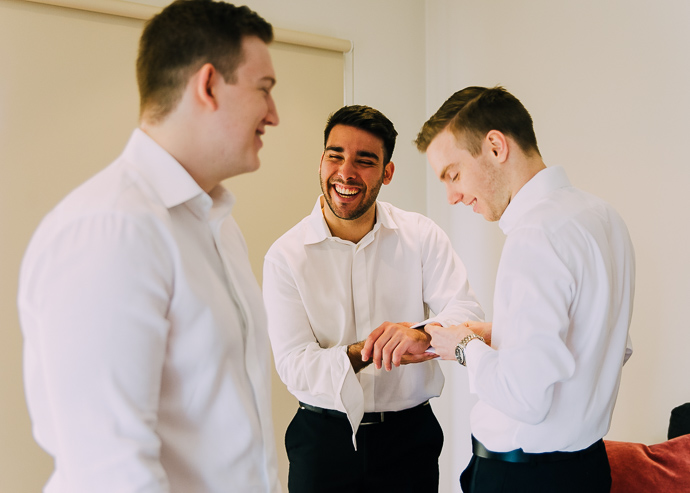Groom and groomsmen getting ready for a wedding