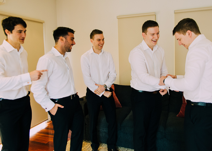 Groom and groomsmen getting ready for a wedding
