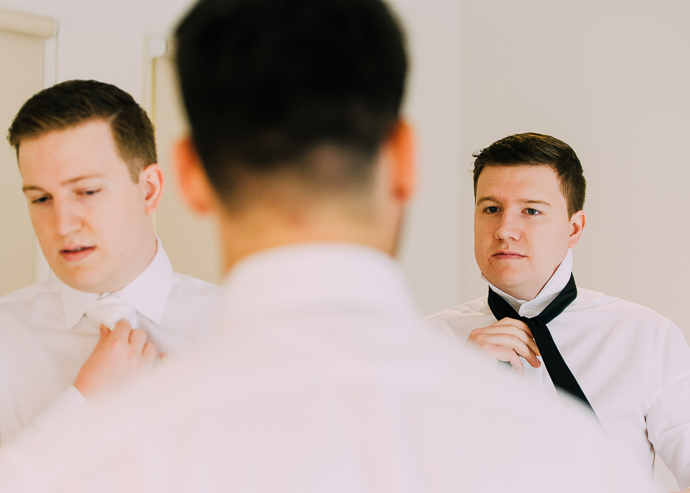 Groom and groomsmen getting ready for a wedding