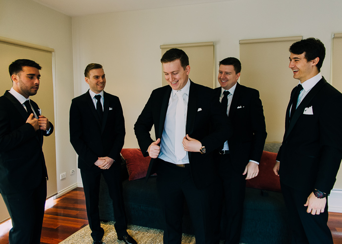 Groom and groomsmen getting ready for a wedding